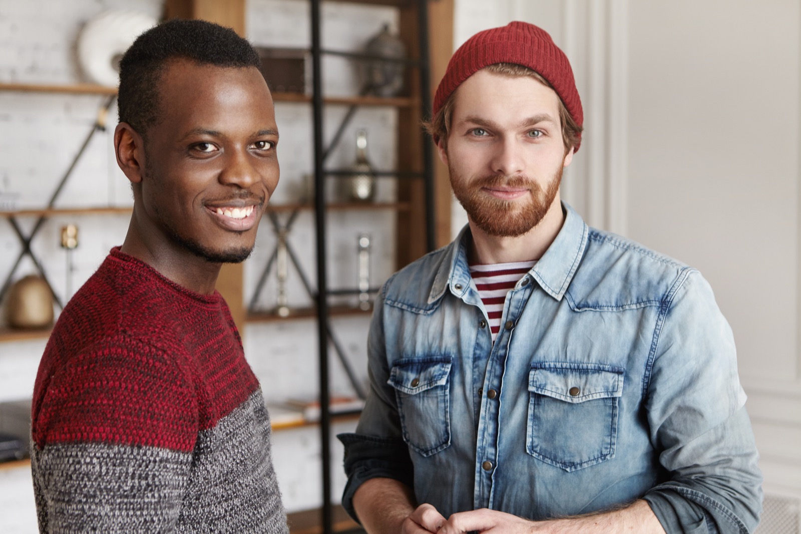 Two men smiling side by side