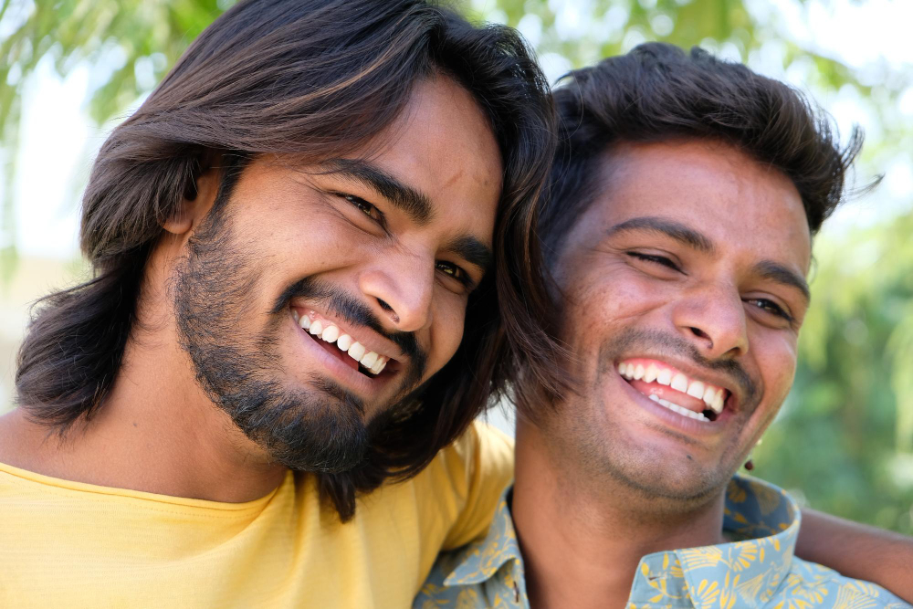 Two men smiling together