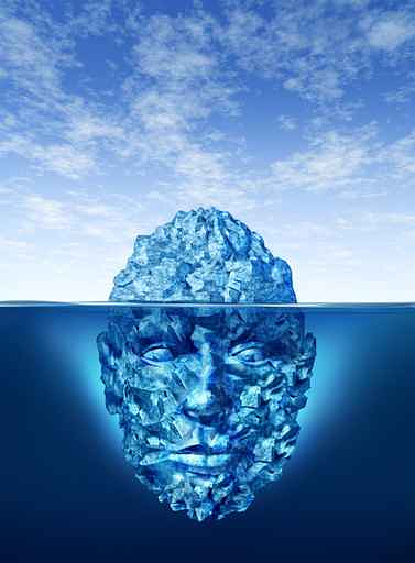 Iceberg in the shape of a gigantic head, submerged from the top of the forehead down to the chin