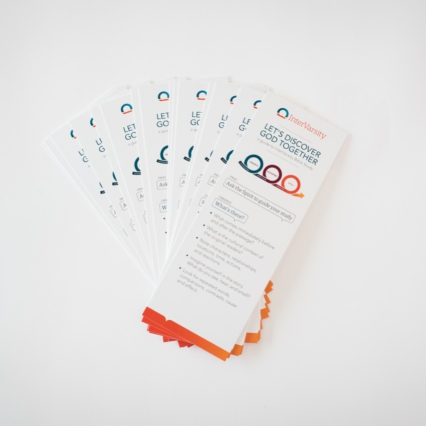 A stack of bookmarks. Each one has 3 interconnected circles on it.