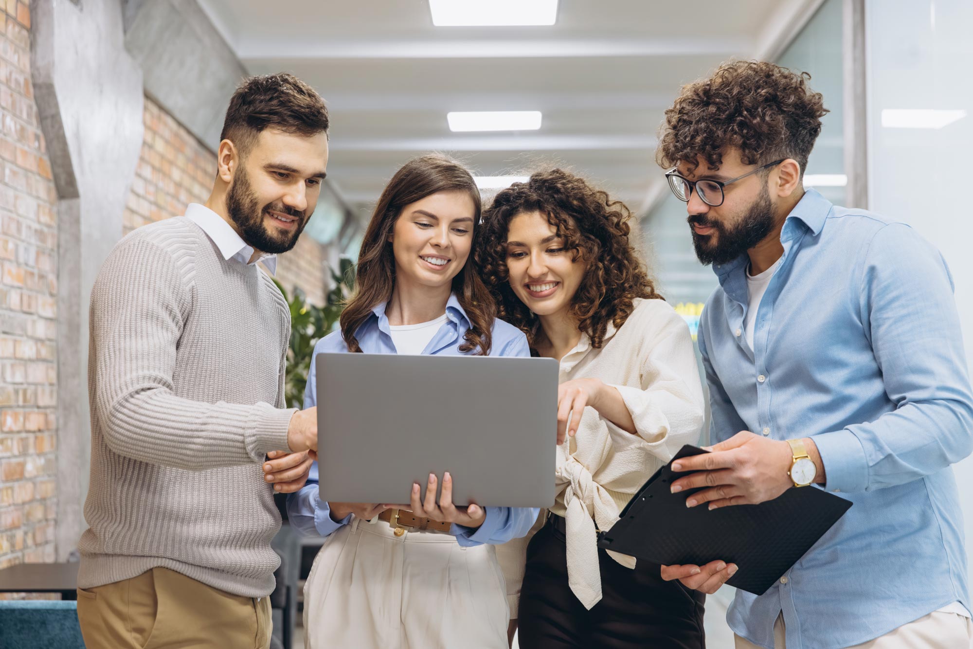 Team reviewing a laptop together