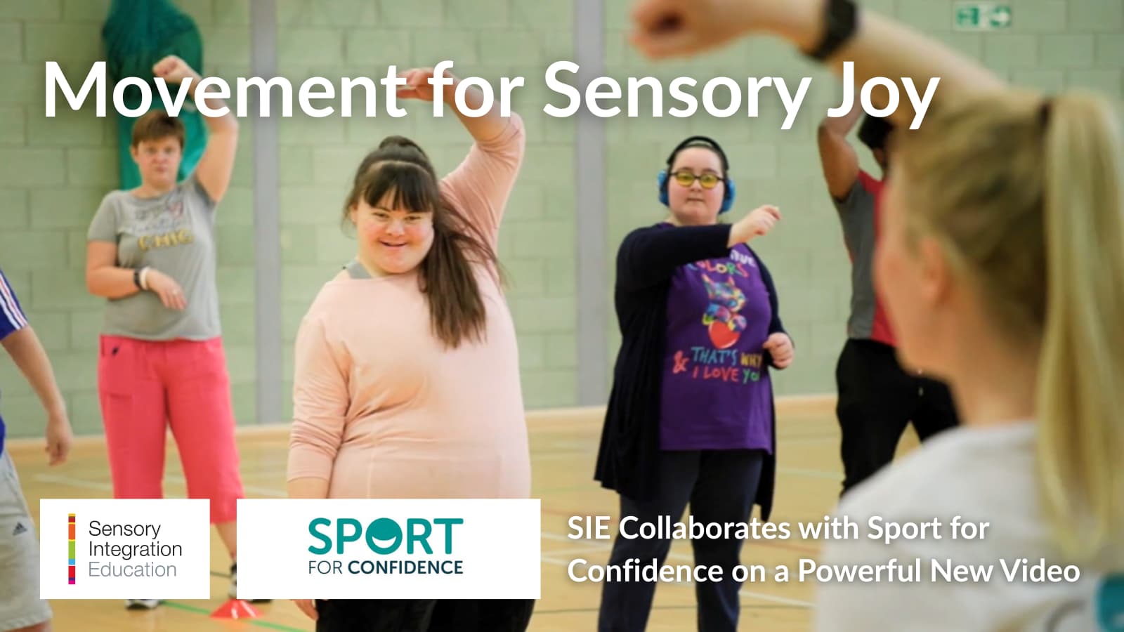 People enjoying an exercise routine in a sports hall