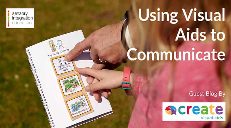 Two people pointing to a book. Title reads Using Visual Aids to Communicate