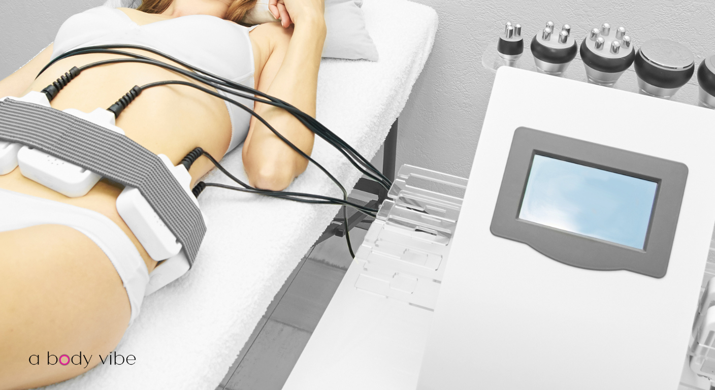 professional body contouring specialist using a cavitation machine in a luxury spa setting