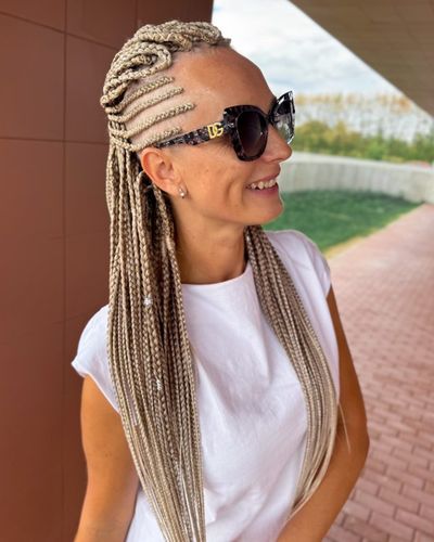 Cornrows on the side flowing into blonde box braids, hair by Olga Olikova