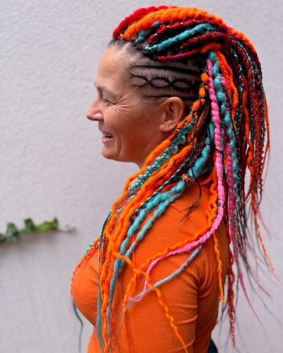 Double-ended dreadlocks in orange, teal and pink, hair by Olga Olikova