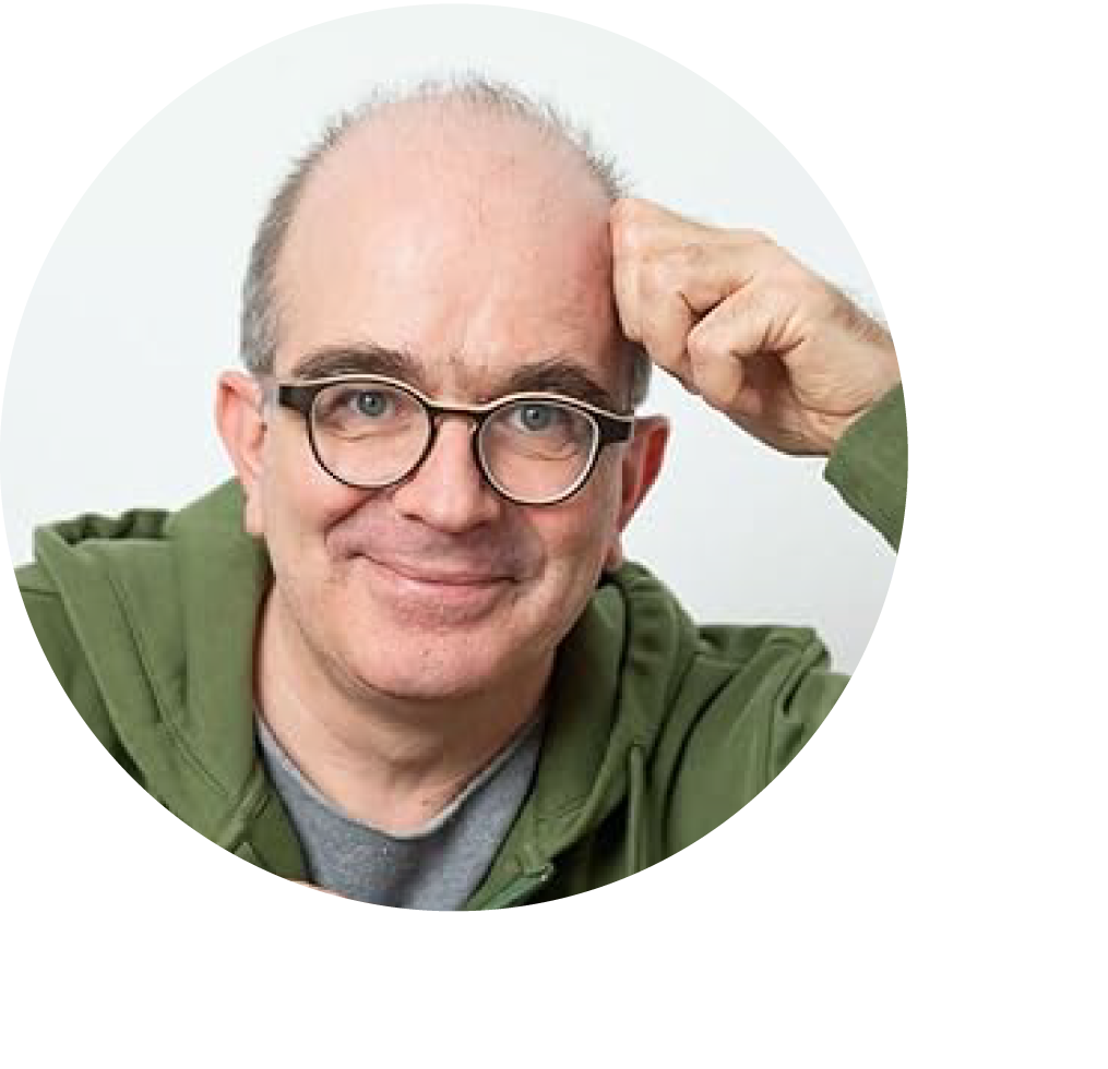 Grinsender Dr. med. Frank Köhnlein mit sehr kurzen dunkelgrauen Haaren, einer runden dunklen Brille und einer grünen Sweatshirtjacke