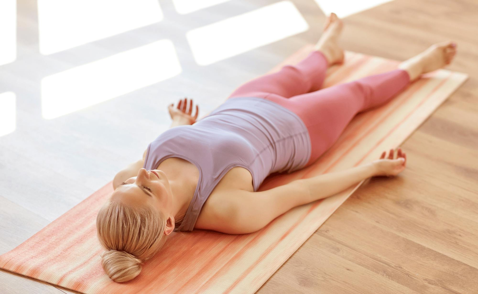 A person lying on a matDescription automatically generated