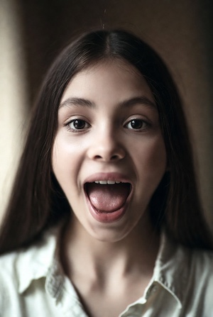 Girl demonstrates vowels