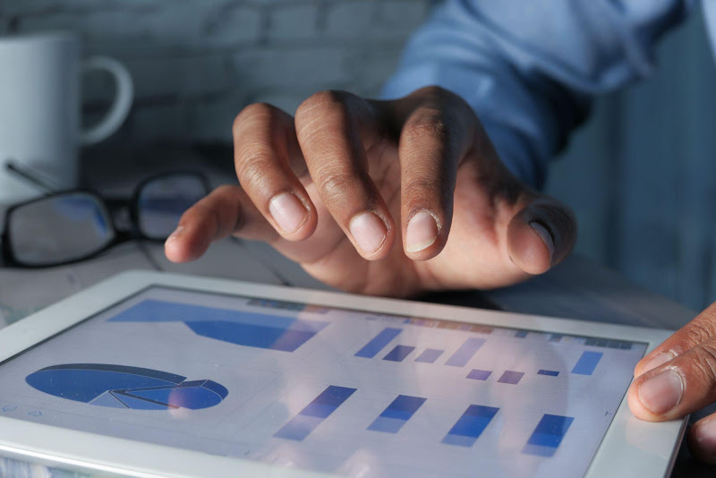 Business owner reviewing campaign performance on a tablet during Facebook Ads consulting
