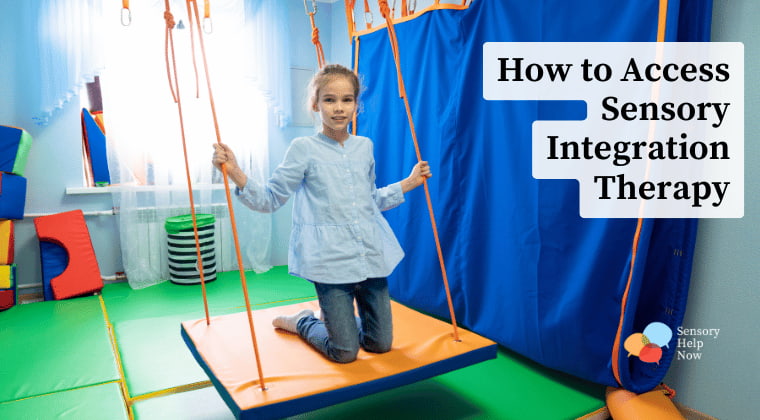 A girl kneels up on a therapy swing in a sensory integration gym