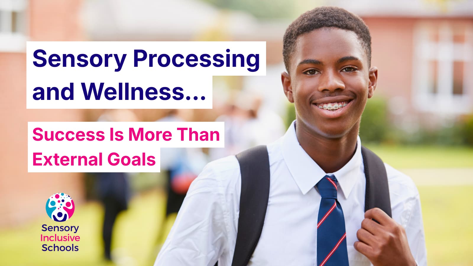 School student in uniform standing outside a school, smiling at the camera.
