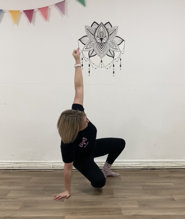 the right knee is further back underneeath the hip. still leaning on the right hand and with the left foot on the floor and left hand in the air