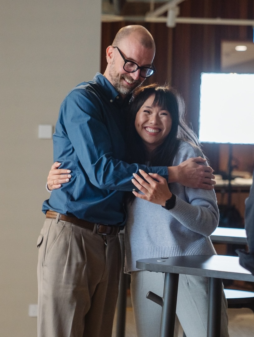 Team members smiling during a Bullshift session
