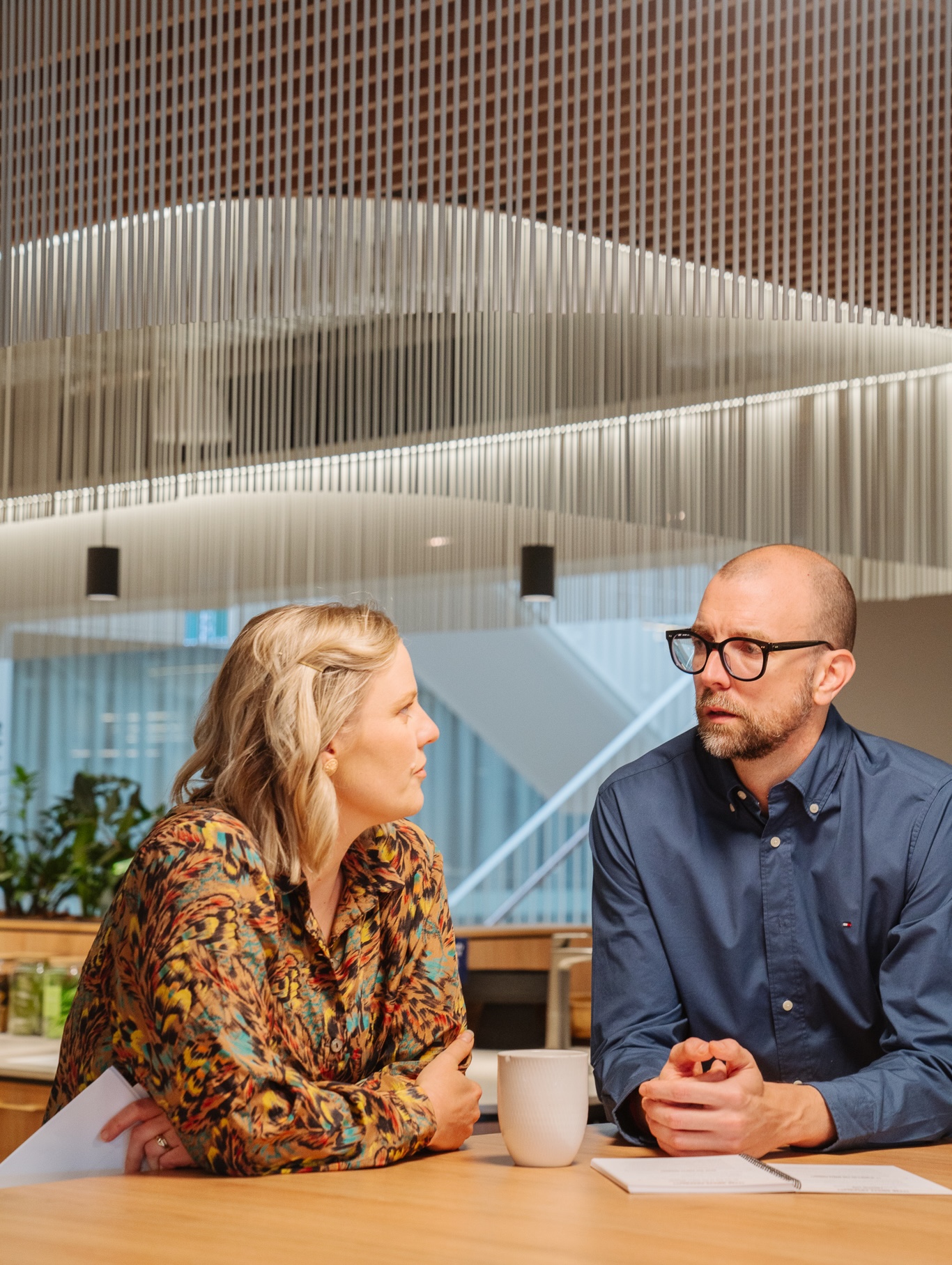 Two people reading the Bullshift book and discussing habits