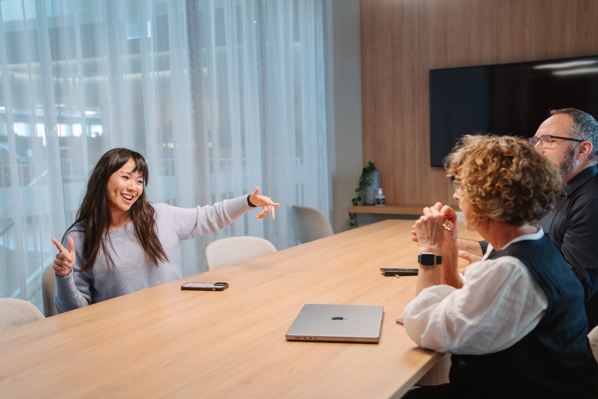 Two colleagues reading Bullshift and having a laugh